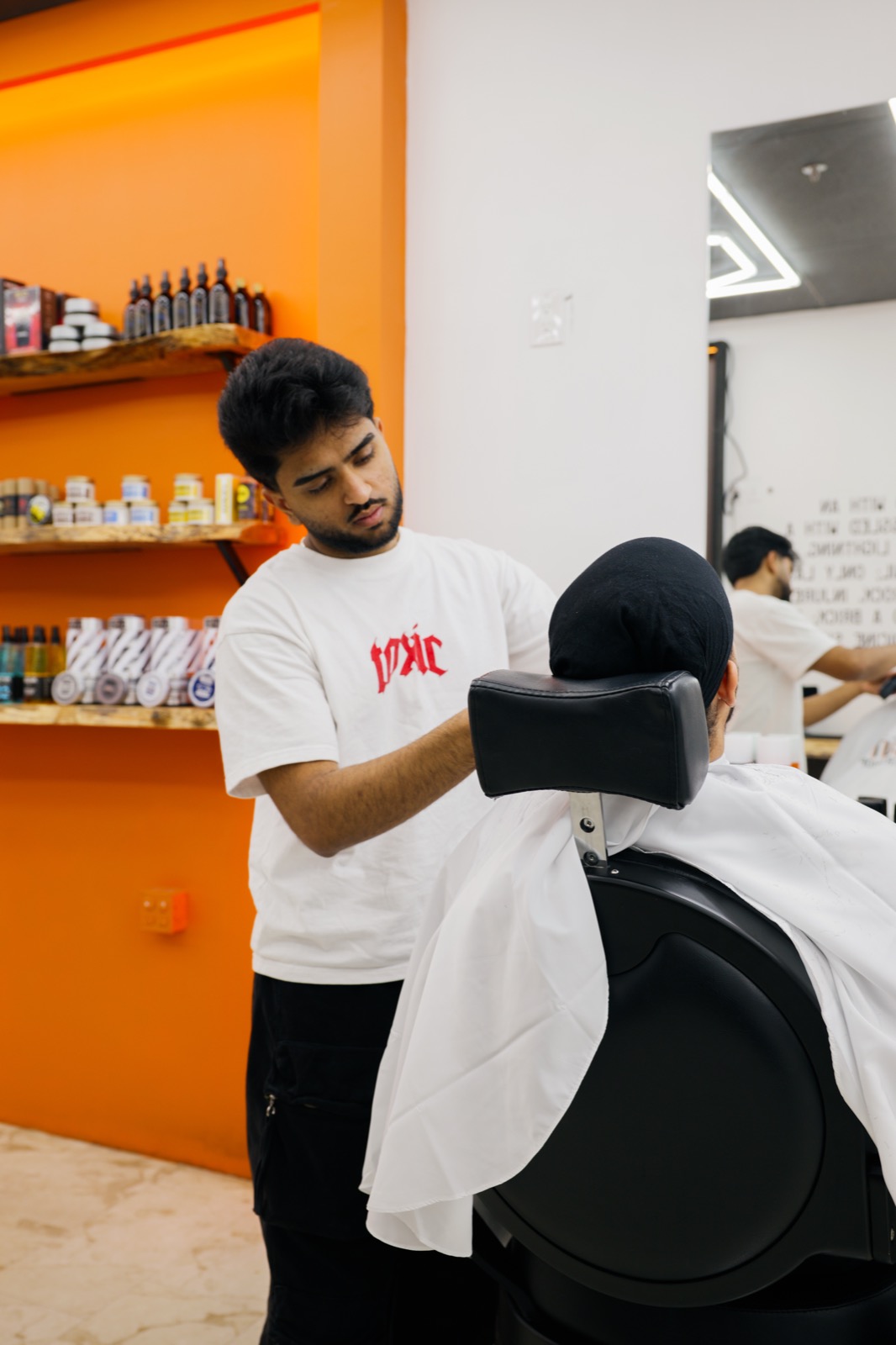 Barber prepping a client chair-side