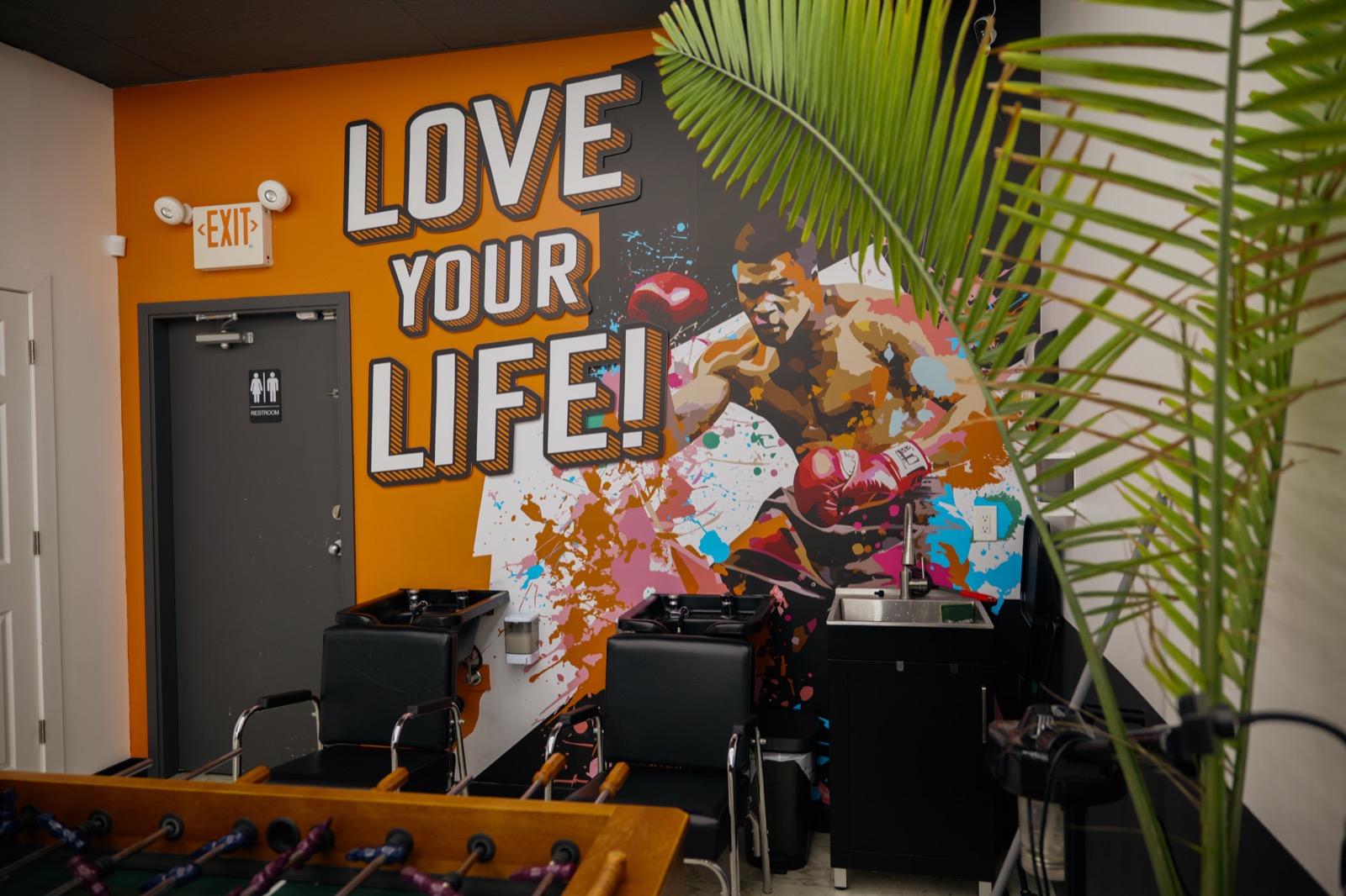 Love Your Life mural and lounge inside Uppercuts Willowbrook